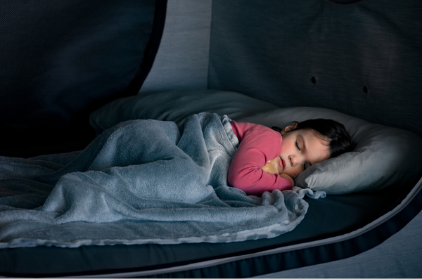 Child sleeping safely in a Cubby Bed