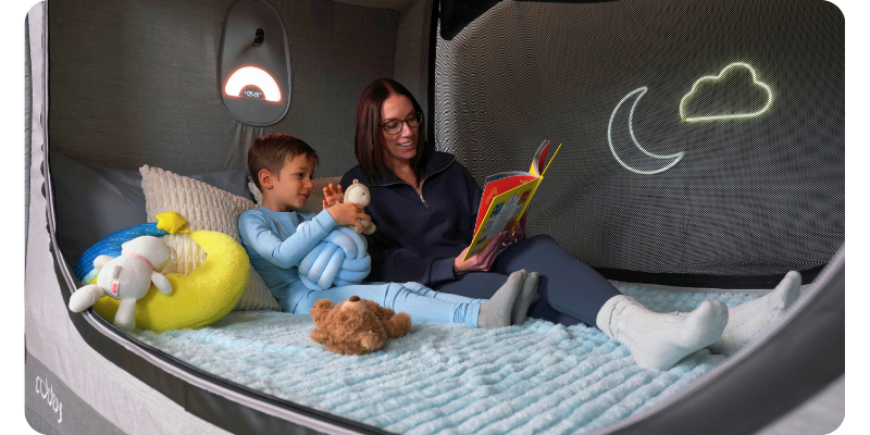 Parent and child reading in a Cubby Bed
